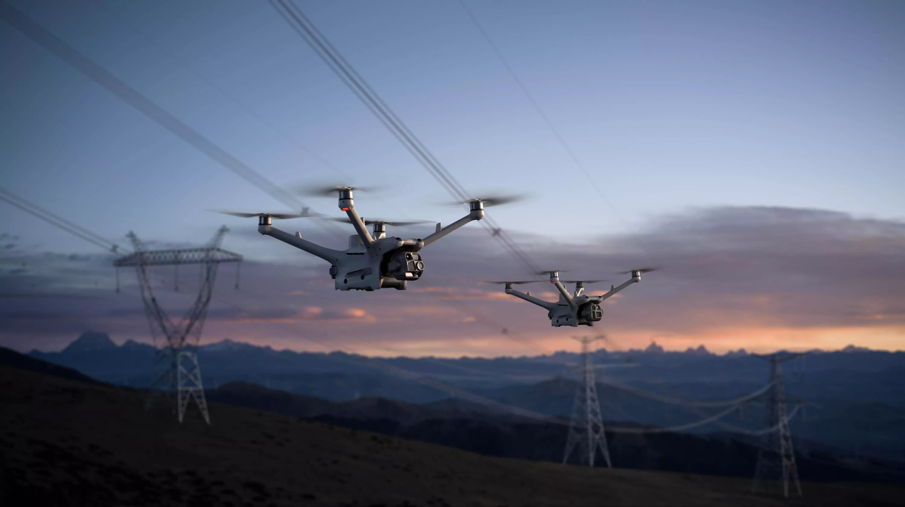 Inspection drones over energy infrastructure at dusk
